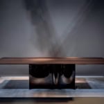 Wood dining table with ebony finish and solid base