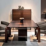Wood dining table with ebony finish in dining room setting