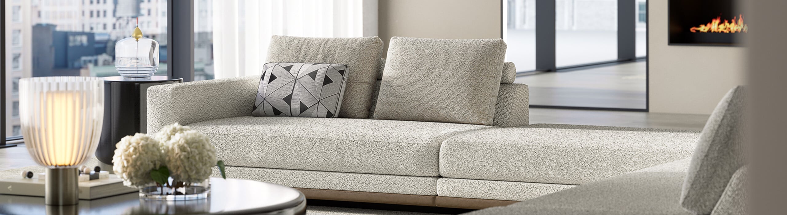 Beige fabric sectional sofa with cushions in living room