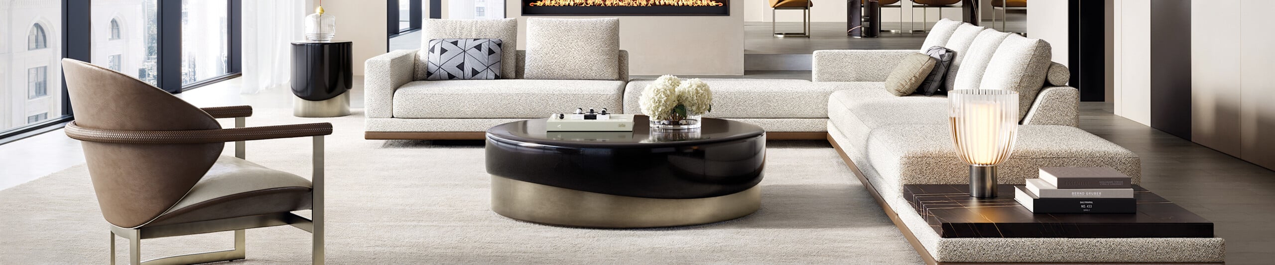 Round coffee table with dark wood top and metal base in living room
