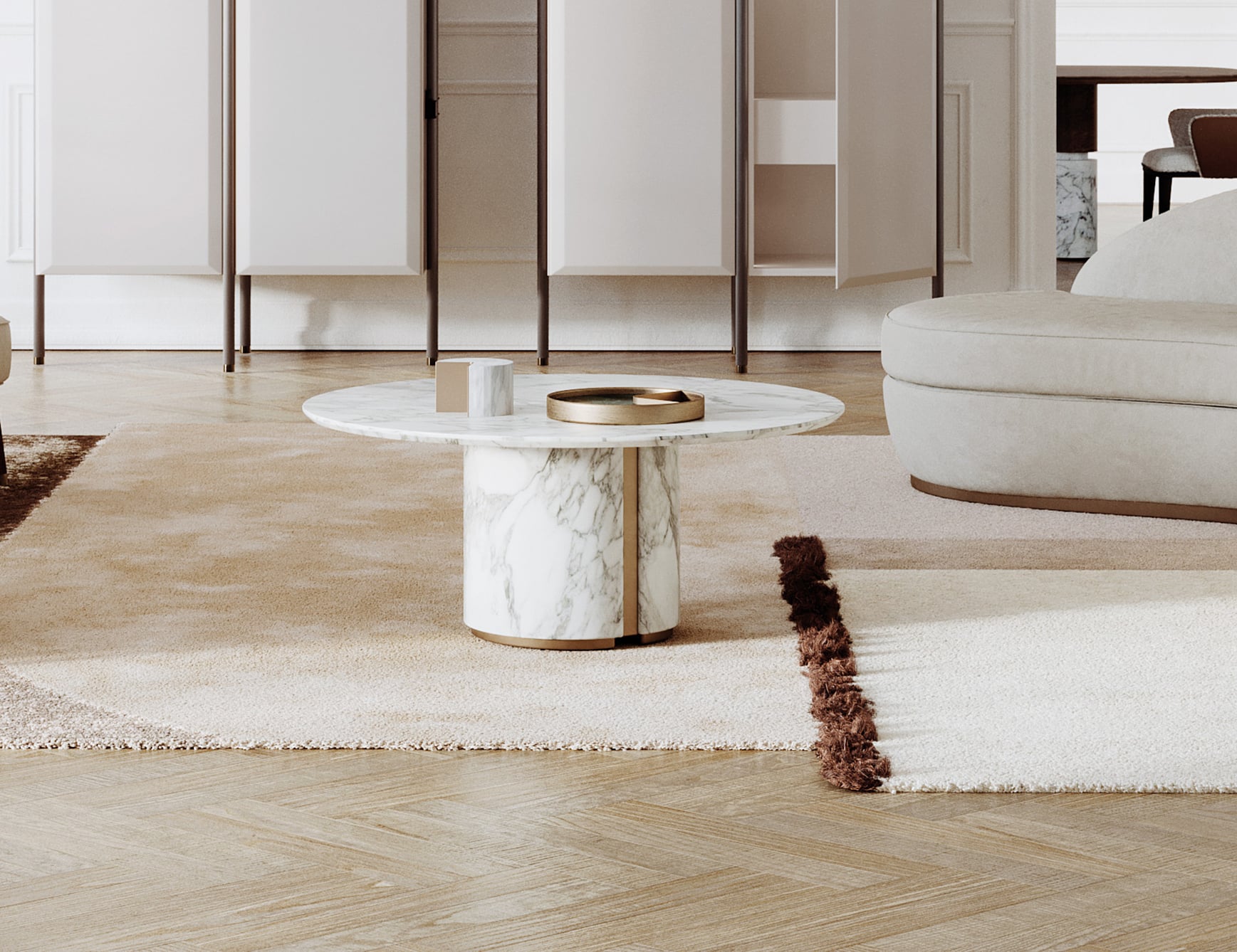 Round marble coffee table with Calacatta finish in living room setting