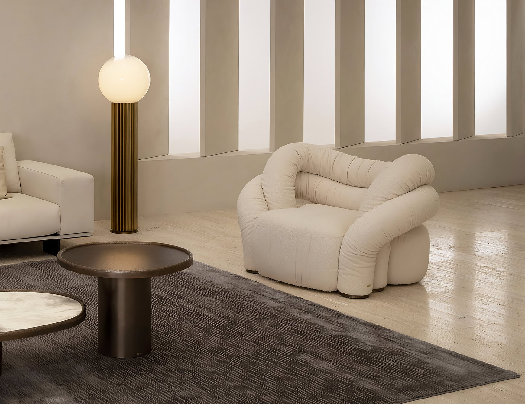 Leather Abbraccio armchair with curved padded design in living room setting
