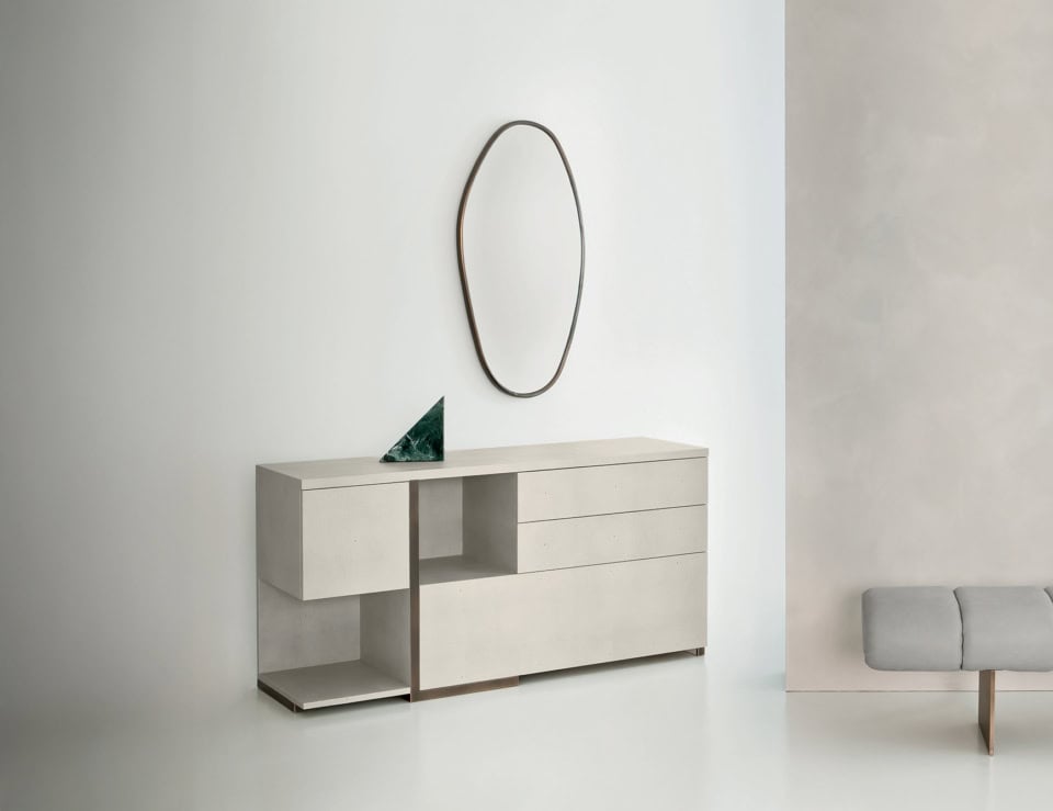 Leather chest of drawers with geometric design in bedroom setting