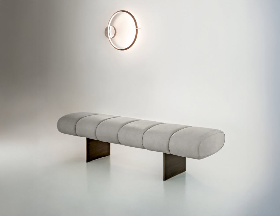 Fabric bench with cylindrical cushion seat and metal base