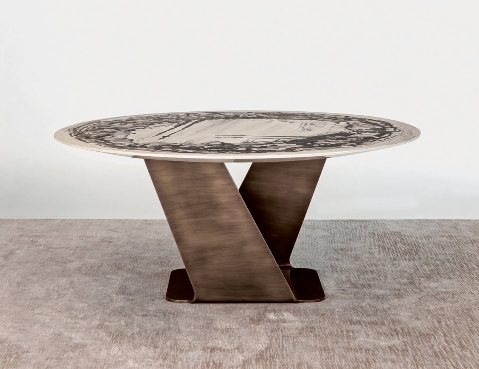 Round marble dining table with Patagonia finish and metal base