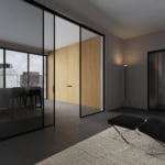 Glass architectural doors with black metal frames in interior setting