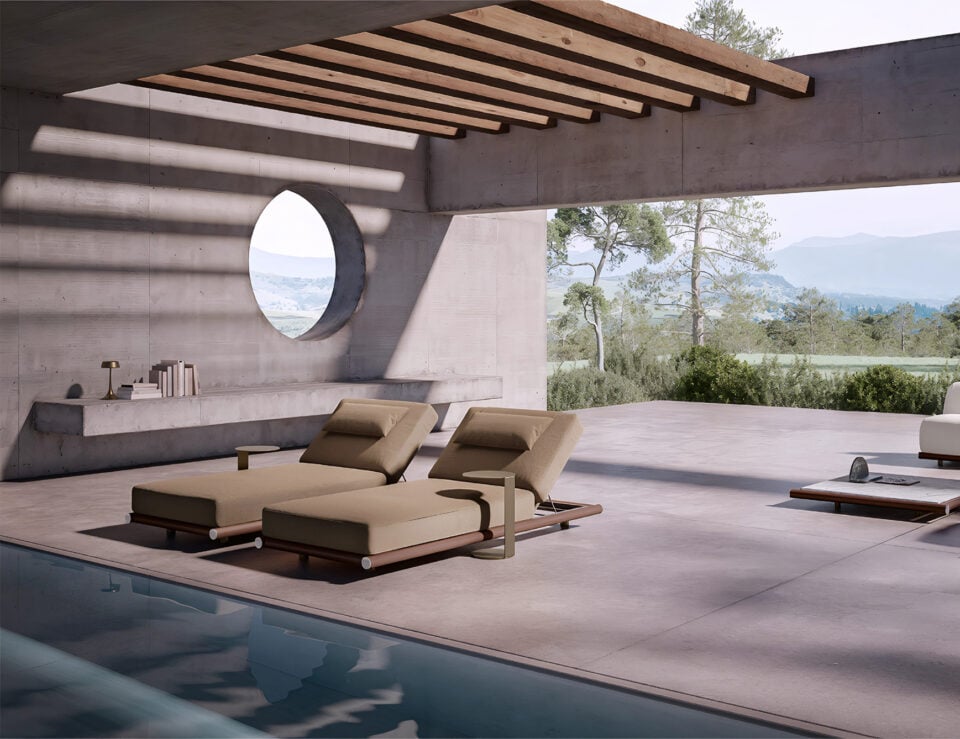 Fabric outdoor lounge chairs with metal frames beside a pool