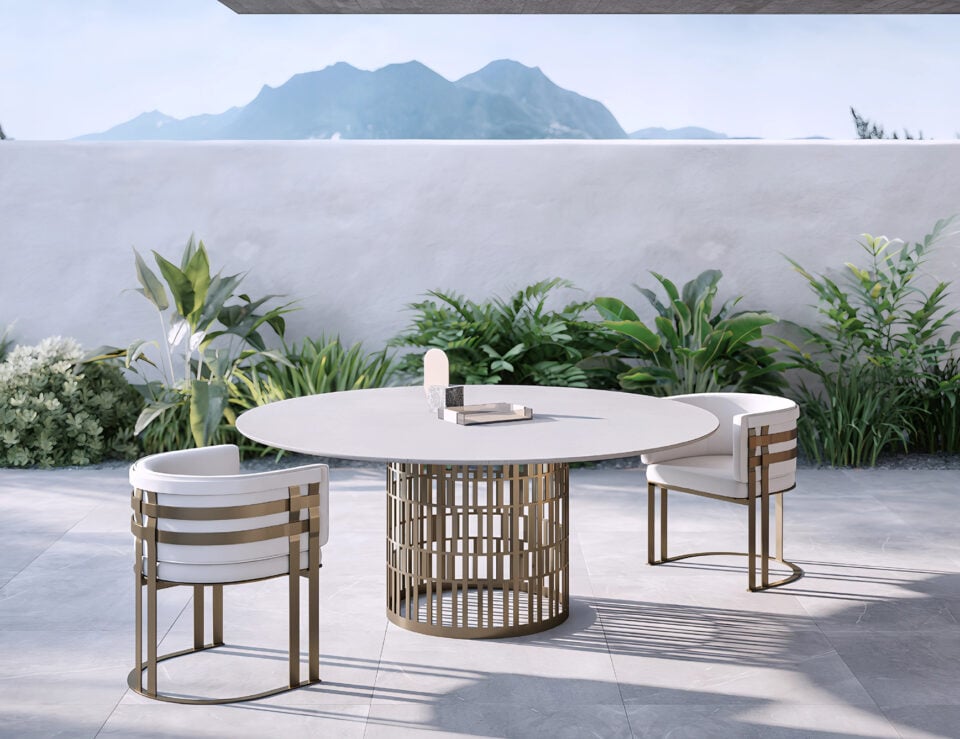 Fabric outdoor dining chair with metal frame beside round table