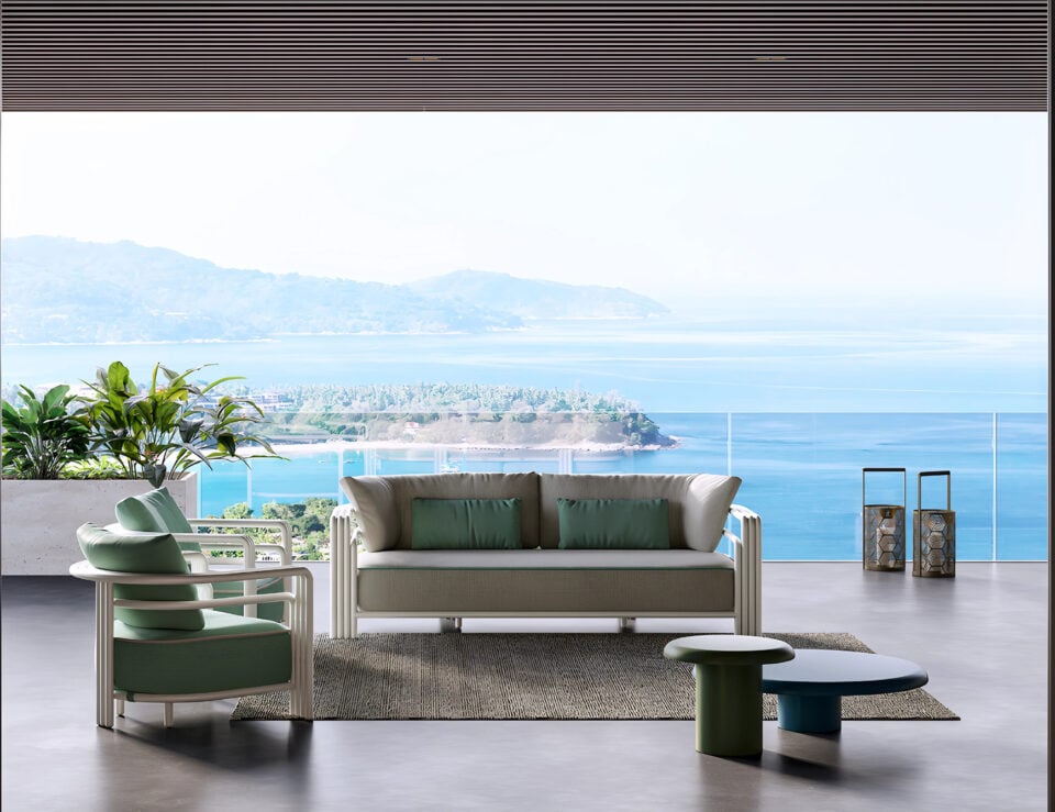 Fabric outdoor Capri sofa with matching armchair and table on terrace