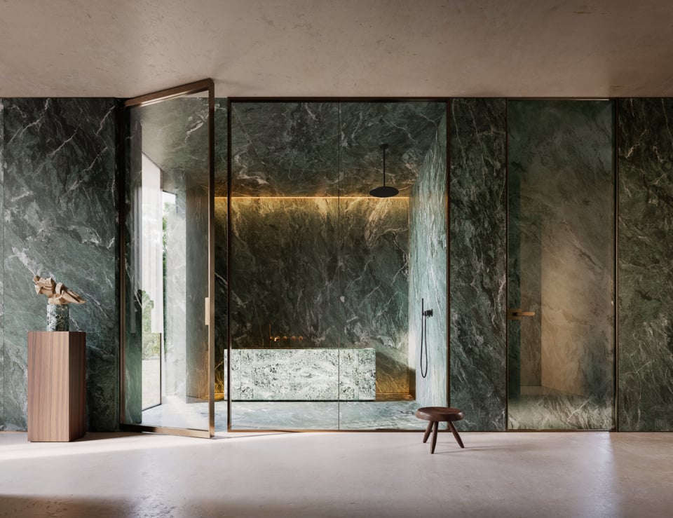 Glass architectural door in a stone-walled setting