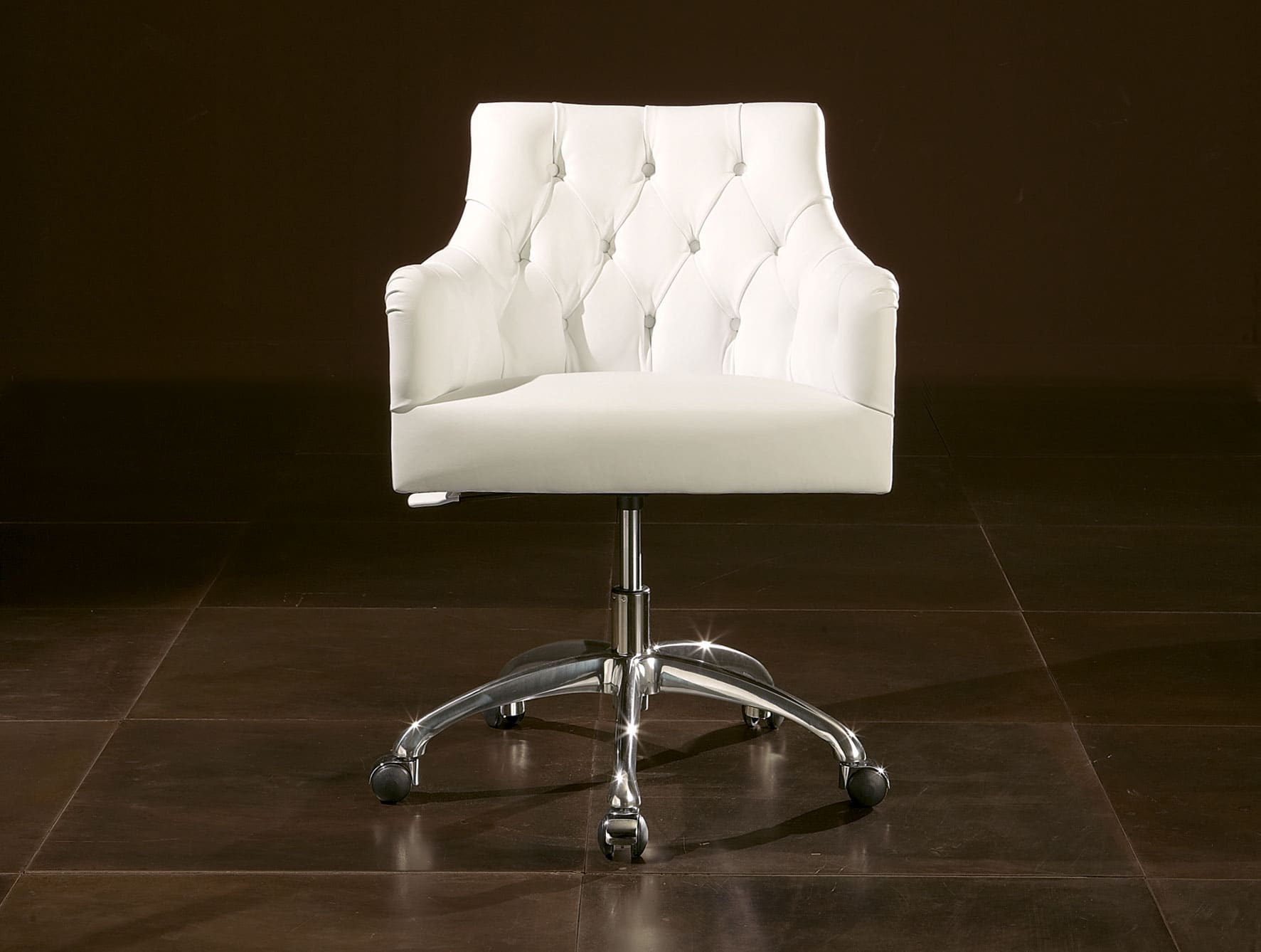 White leather office chair with metal base and casters
