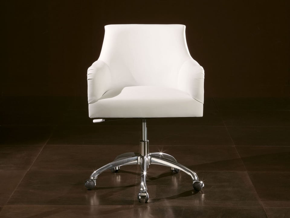 White leather office chair with metal base on wheels