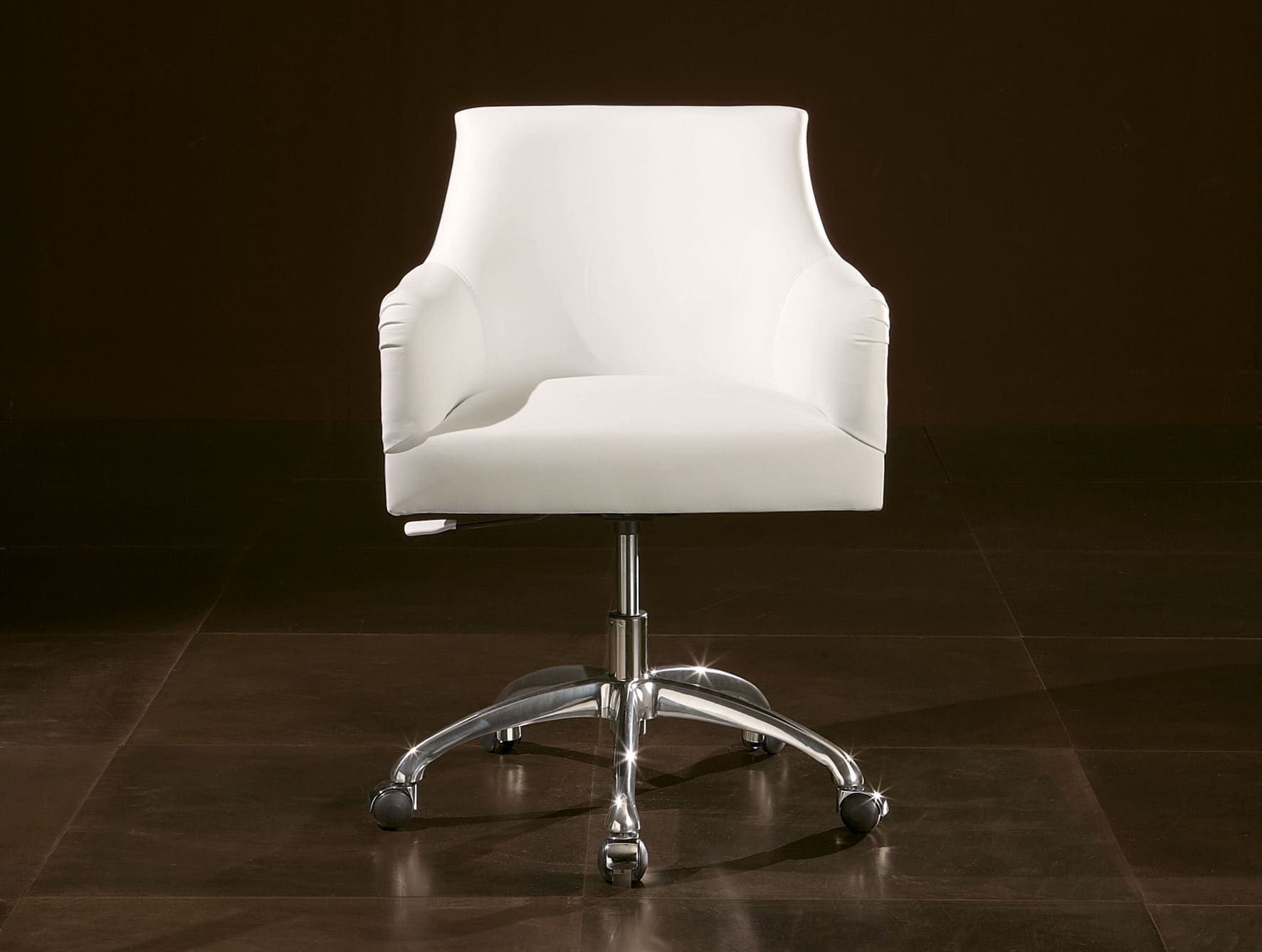 White leather office chair with metal base on wheels
