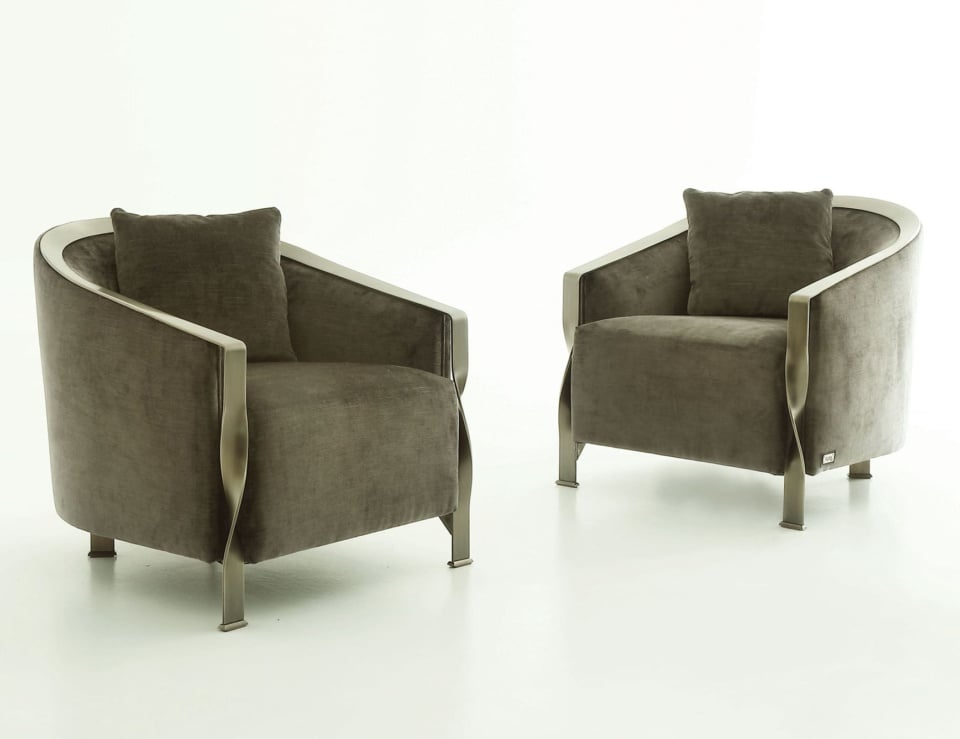 pair of leather sofa chairs with metal frame