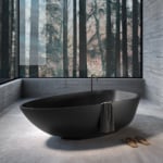 Resin bathtub in neutral bathroom setting.