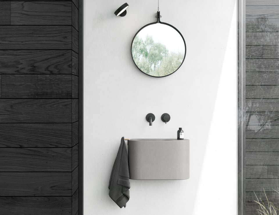 Resin washbasin in bathroom setting with mirror.