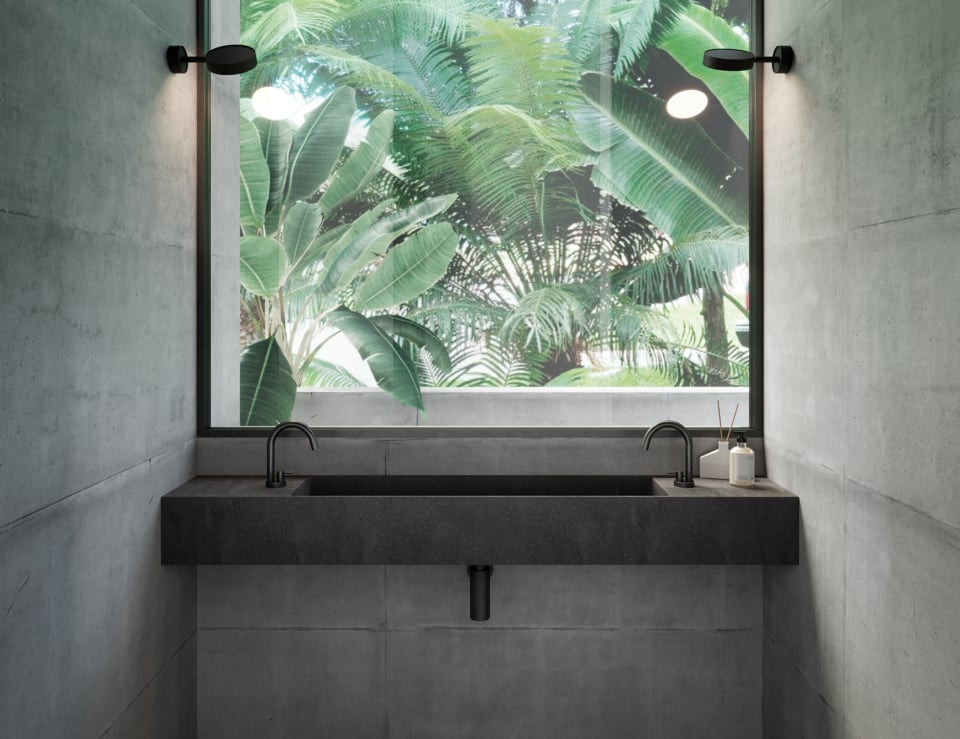 Resin washbasin in concrete bathroom setting