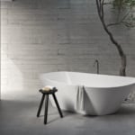 Resin bathtub in bathroom setting with tree