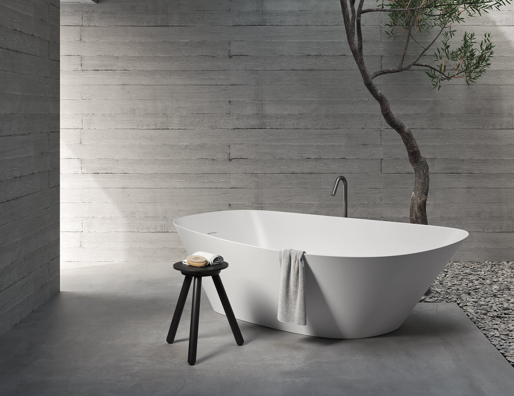 Resin bathtub in bathroom setting with tree