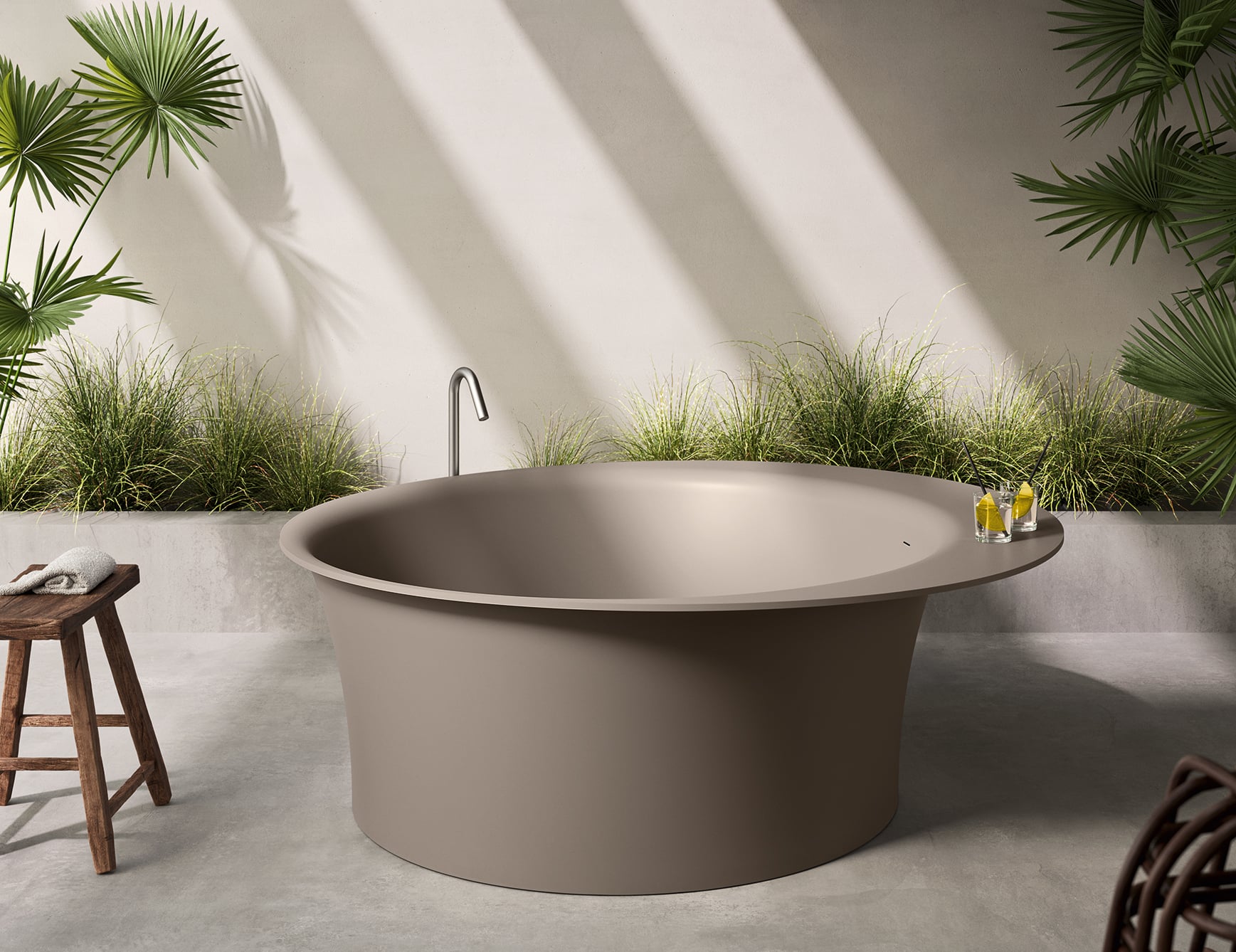 Resin bathtub in a setting with plants.