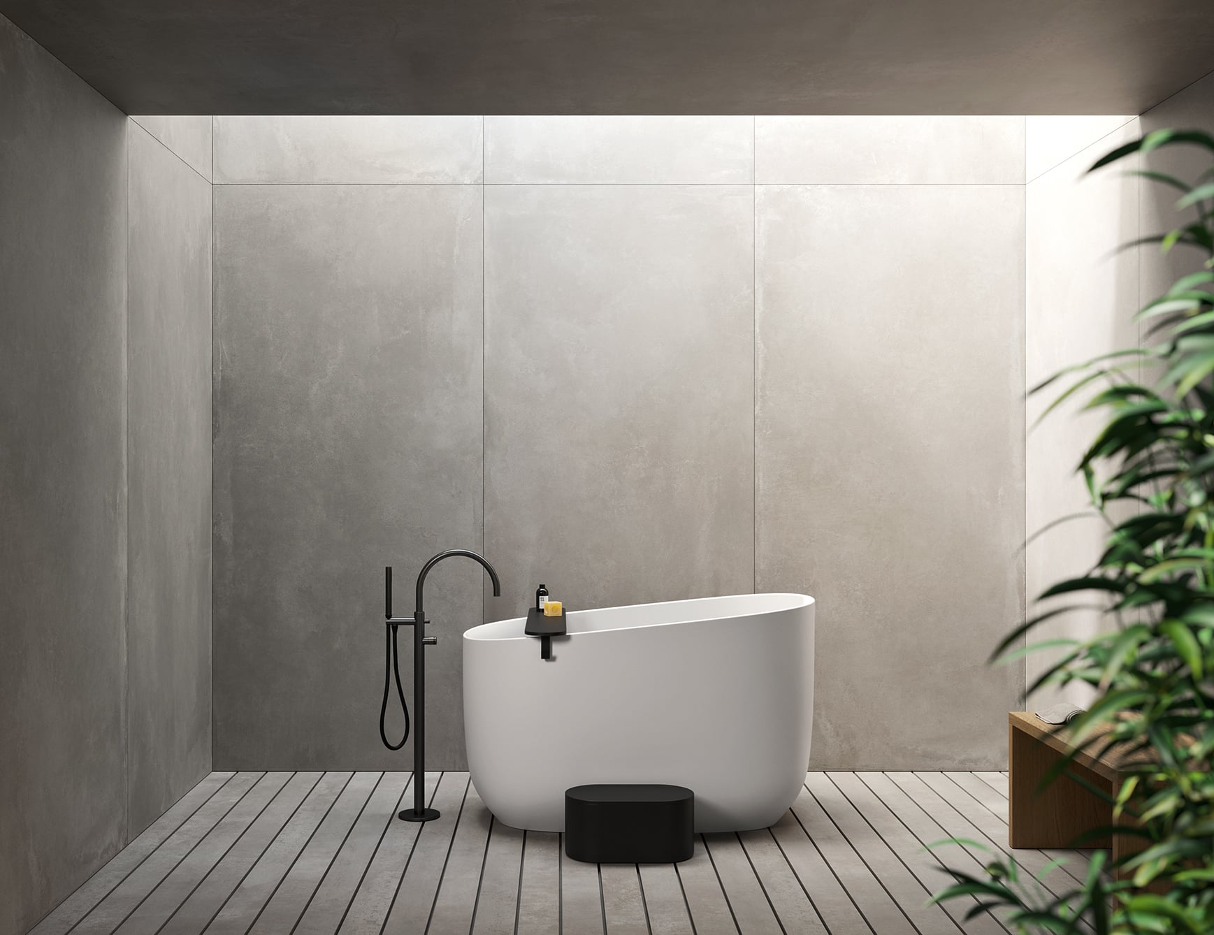 Resin bathtub in bathroom with wood floor