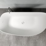 White resin bathtub with curved edges and metal faucet