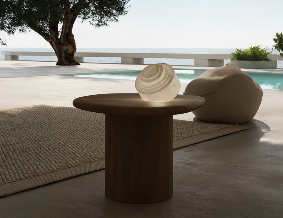 Alabaster hanging pendant light displayed on outdoor table