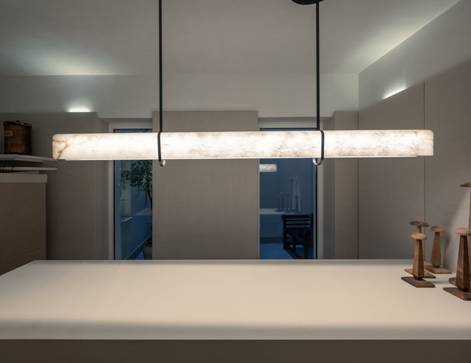 Alabaster ceiling light fixture in interior setting.