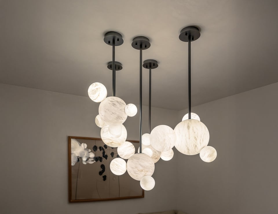 Alabaster hanging suspension lights with spherical design.
