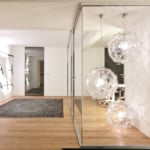 Glass and wood sliding architectural door in an interior setting.
