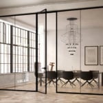 Glass and wood sliding door dividing a room