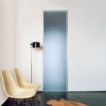 Minimalist room with chairs and frosted door