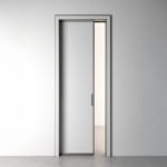 Partially open sliding door in minimalist room
