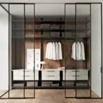 Modern walk-in closet with glass doors