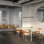 Modern office with glass walls and yellow chairs