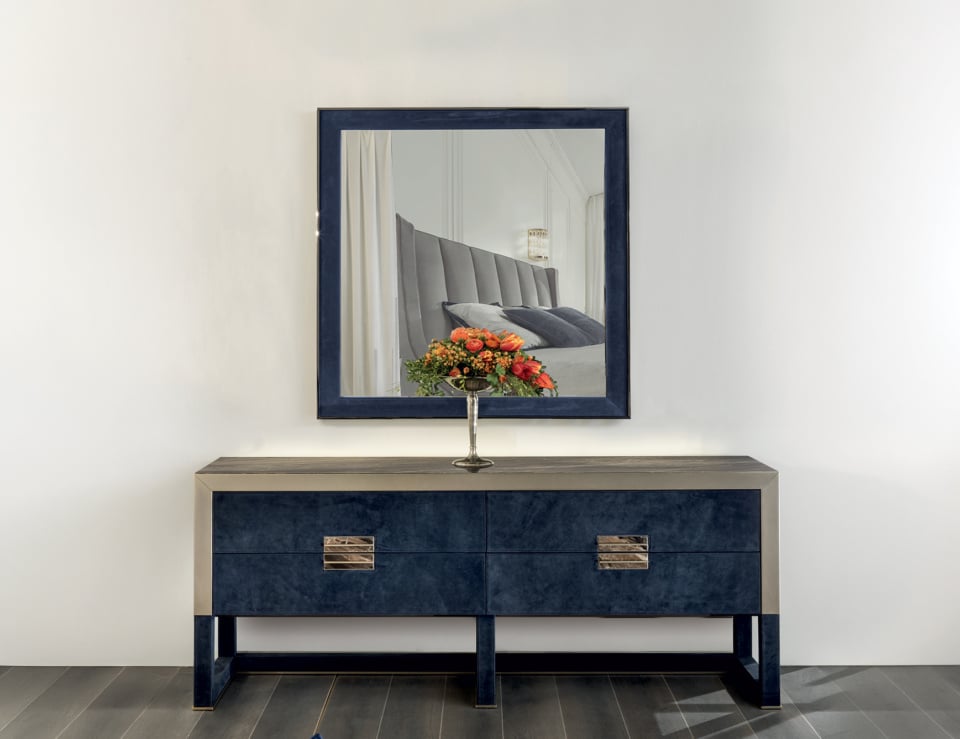 Elegant dresser with mirror and flowers