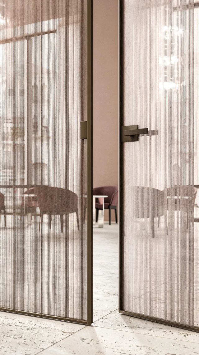 Featuring the Manhattan door system from Italy, featuring a custom channelled glass system showcasing the linen glass pattern with a satin bronze frame structure. Metal finish options include black, white, aluminum, titanium, moka, and brass. The linen glass can be completely customized by color and pattern size, creating an elegant vertical design. The Manhattan custom door collection offers adaptability for sophisticated atmospheres in living and bedroom areas, available as a 180-door, swing door, disappearing sliding door, outside sliding door, or wall system. Finishes and profiles can be customized upon request.
#nellavetrina #livingroomdesign #livingroomdecoration #livingroominspiration #luxurylivingroom #livingroomgoals #italianfurniture #fireplace #pool #wallunit #bar #bookcase #customfurniture #italiandesign #interiordesign #decoration #interiordecor #modernfurniture #customdesign #contemporaryfurniture #homedecor #italianinterior #custommade #architecture #interiordesigner #luxuryfurniture #luxuryliving #italianliving #luxurydesigns